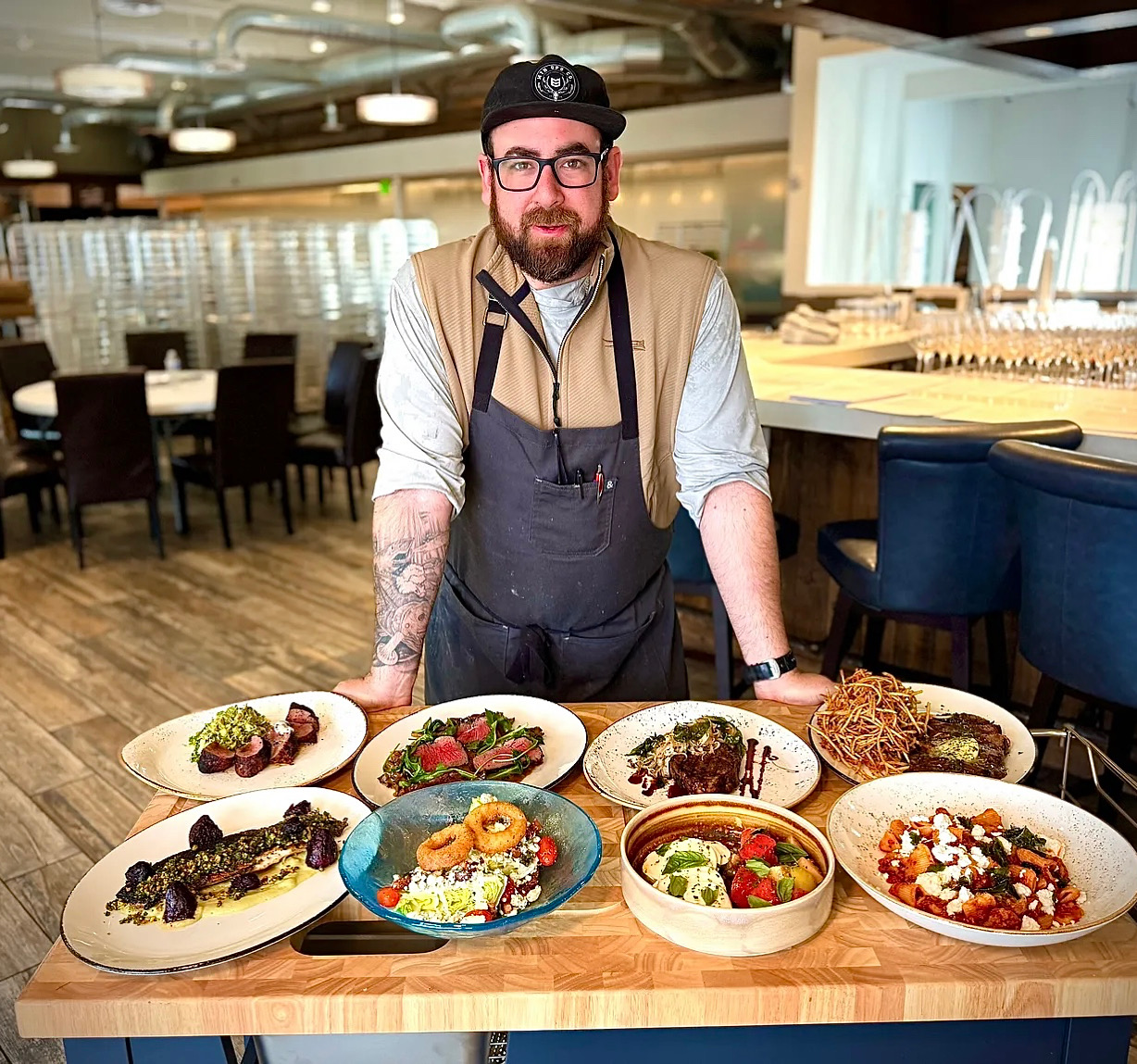 Chef Joe Bonavita in professional kitchen with signature dishes